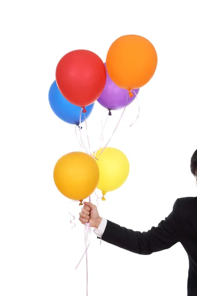 Mão de negócios com balões coloridos — Fotografia de Stock