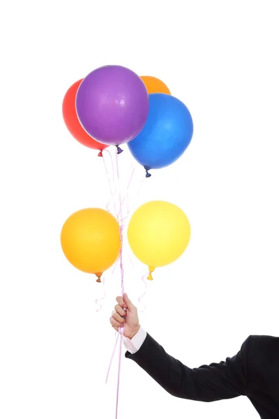 Main d'affaires avec des ballons colorés — Photo