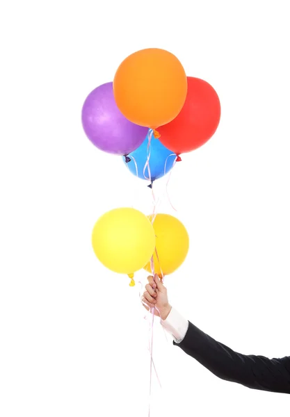 Main d'affaires avec des ballons colorés — Photo