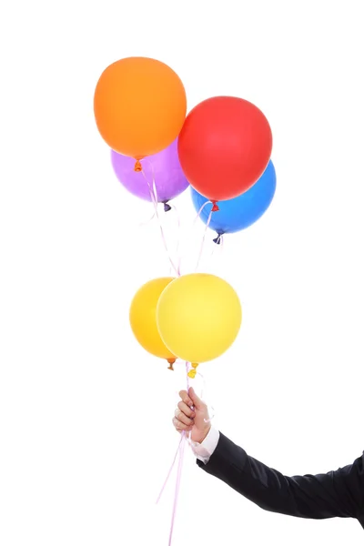 Üzleti kézzel színes léggömbök — Stock Fotó