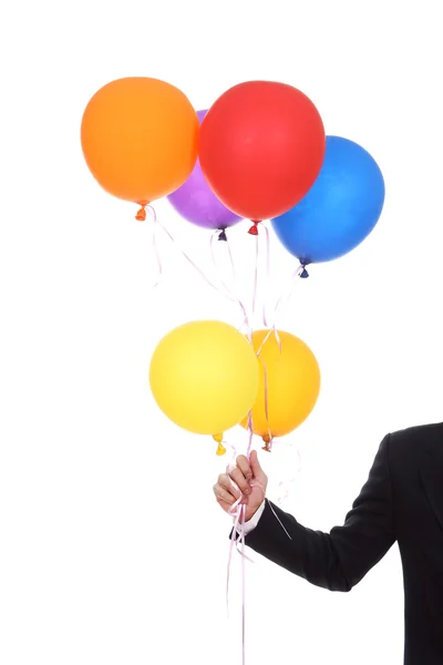 Zakelijke hand met kleurrijke ballonnen — Stockfoto