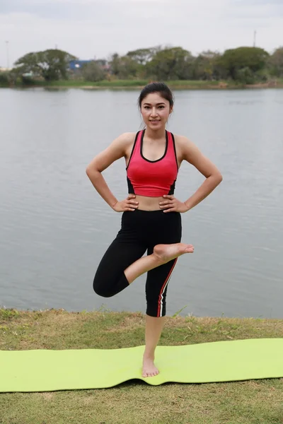 Young woman doing yoga exercise — Stock Photo, Image