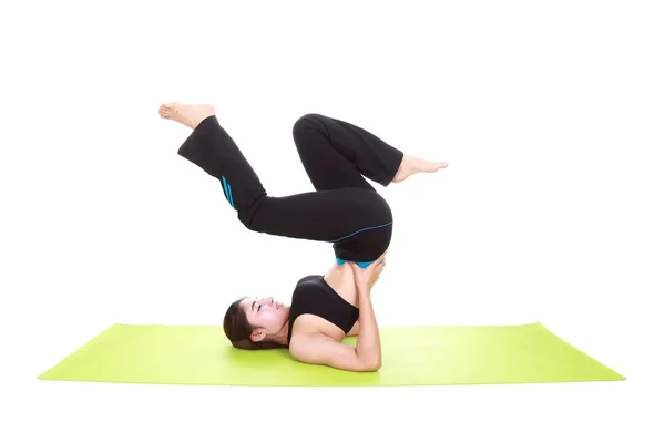 Young woman doing yoga exercise with yoga mat — Stock Photo, Image