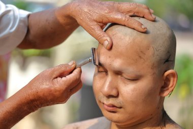 Male who will be monk shaving hair for be Ordained