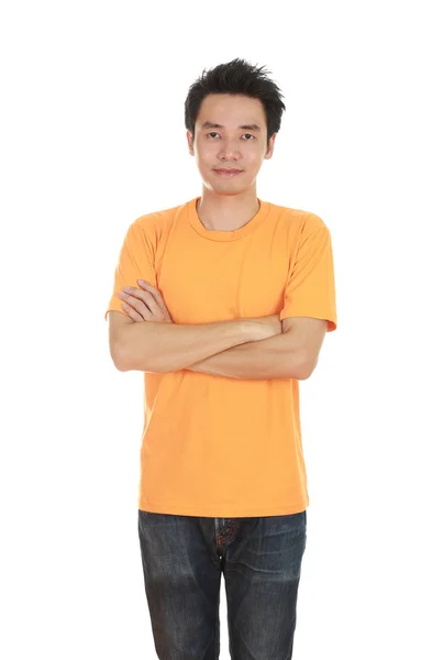 Man with arms crossed, wearing t-shirt Stock Image