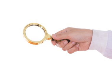 Büyüteç bir pirinç Glas tutan el