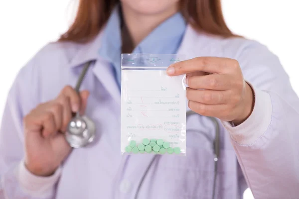 Close up pills with female doctor — Stock Photo, Image