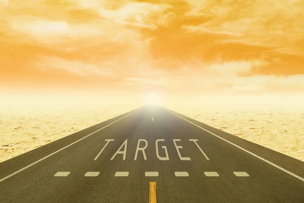 Road through the desert with sign target on asphalt at sunset — Stock Photo, Image
