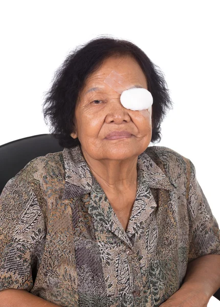 Medicine plaster patch on old woman injury wound eye — Stock Photo, Image