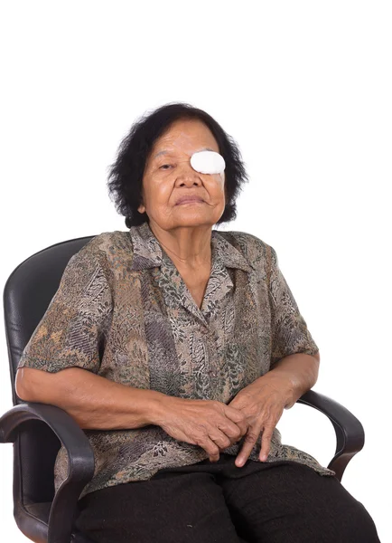 Medicine plaster patch on old woman injury wound eye — Stock Photo, Image