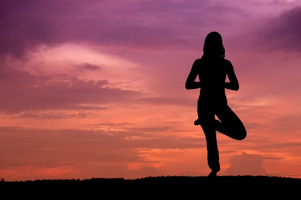 Silhouette of a beautiful Yoga woman — Stock Photo, Image