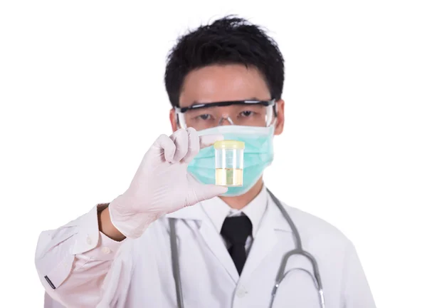 Doctor's hand holding a bottle of urine sample — Stock Photo, Image