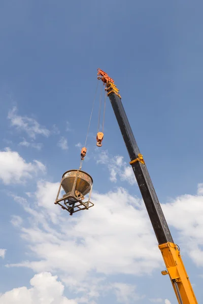 Crane lifting concrete mixer container — Stock Photo, Image