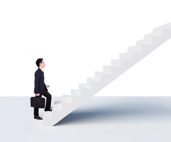 Hombre de negocios subiendo escaleras — Foto de Stock