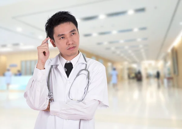 Doctor thinking in hospital — Stock Photo, Image