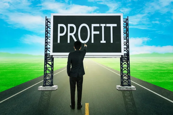 Businessman standing on road and pointing with large sign of pro — Stock Photo, Image