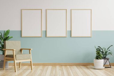 Oturma odasındaki beyaz ve yeşil duvarlardaki resim çerçevesi 3D döşeme üzerinde koltuk ve saksılarla süslenmiş.