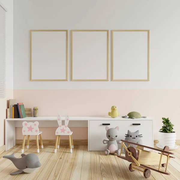 Children's room with a picture frame on the walls in white and cream colors. With books placed on the table and toys on the floor.3d rendering