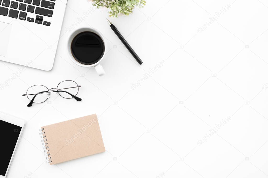 White office desk table with a lot of things on it. Top view with copy space, flat lay.