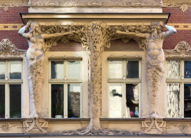 Art Nouveau Sculpture on the Facade of a Palace in Riga clipart