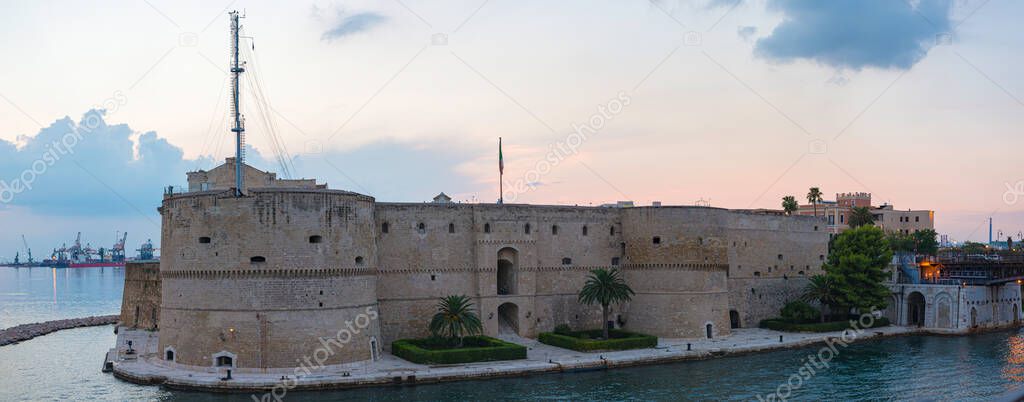 Aragonese Castle of Taranto and revolving bridge on the channel between Big and Small sea at sunset , Puglia. Italy