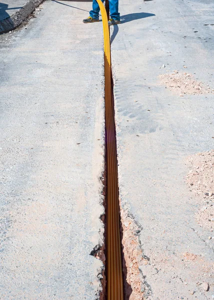 Worker Inserts Fiber Optic Cables Buried Micro Trench — Stock Photo, Image