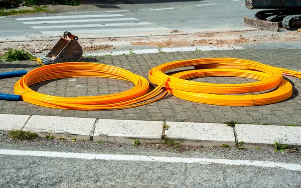 Long Coils Orange Plastic Pipes Installation Underground Utilities Energy Optical — Stock Photo, Image