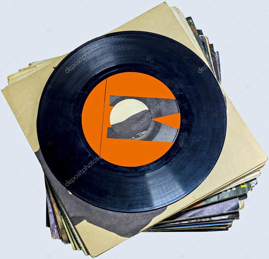 A pile of 45 RPM vinyl records used and dirty even if in good condition