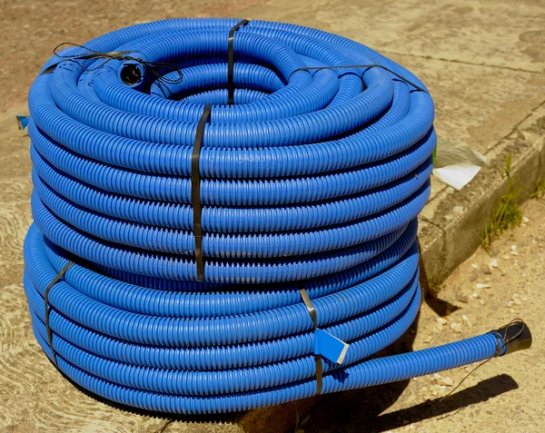 Roll of corrugated conduit for microtrench in urban areas — Stock Photo, Image