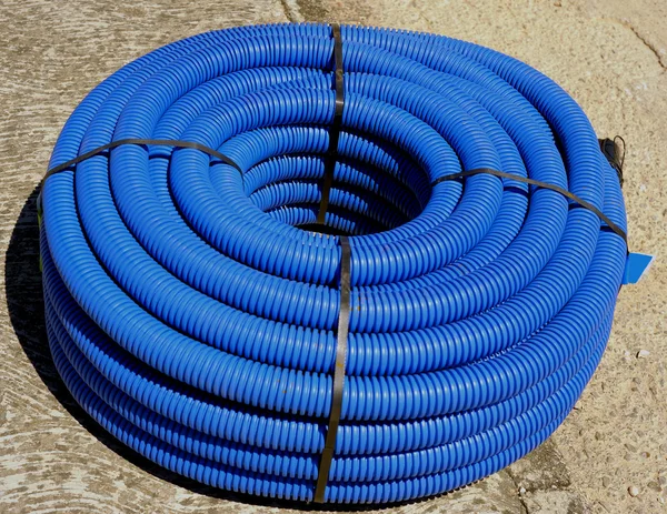 Roll of corrugated conduit for microtrench in urban areas — Stock Photo, Image