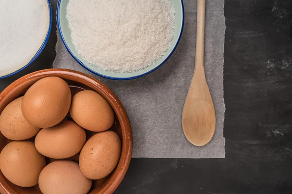 Ingredients for baking a cookies. Recipe for coconut macaroons.