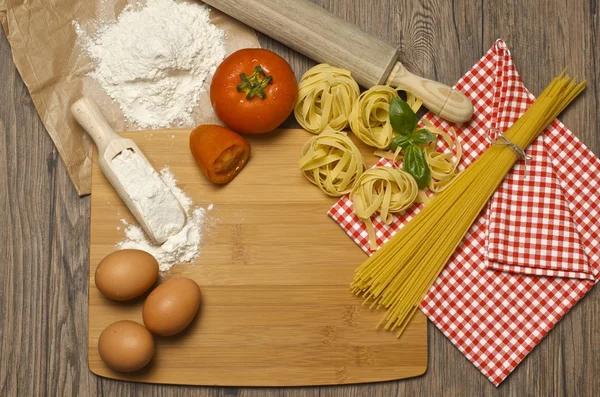 Pasta and ingredients for pasta — Stock Photo, Image