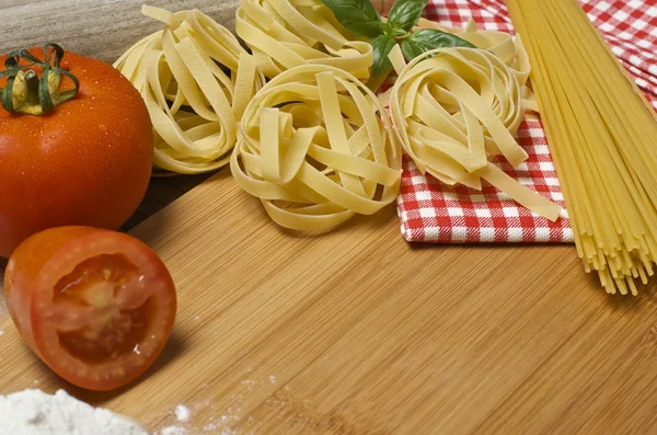 Pasta and ingredients for pasta — Stock Photo, Image