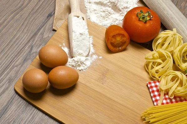 Pasta and ingredients for pasta — Stock Photo, Image