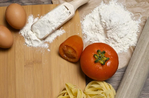 Pasta and ingredients for pasta — Stock Photo, Image