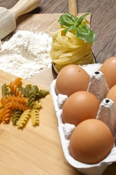 Pasta and ingredients for pasta — Stock Photo, Image