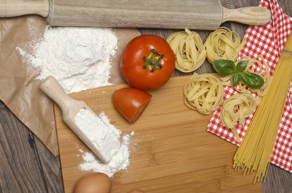 Pasta and ingredients for pasta — Stock Photo, Image