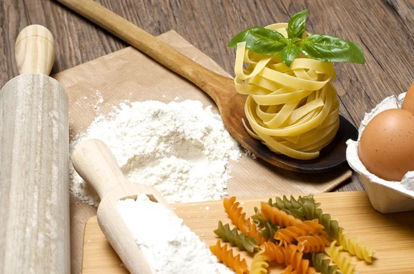 Pasta and ingredients for pasta — Stock Photo, Image