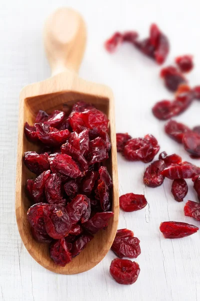 Wooden scoop of dried cherries — Stock Photo, Image