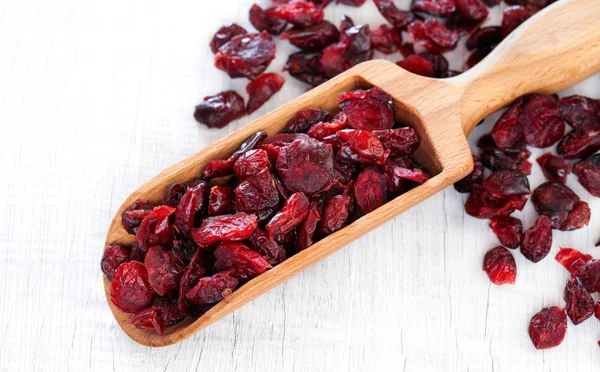 Wooden scoop of dried cherries — Stock Photo, Image