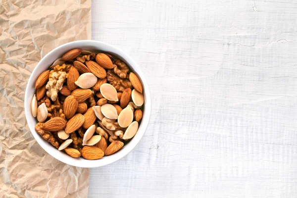 Full bowl of nuts and pumpkin seeds — Stock Photo, Image