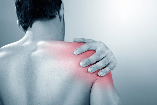 Man suffers from Shoulder pain Stock Image