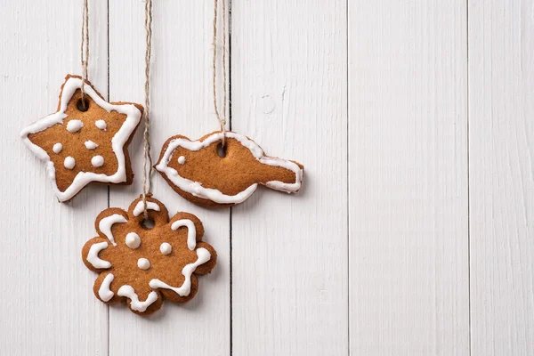 Cookies made by hand in the form of Christmas ornaments