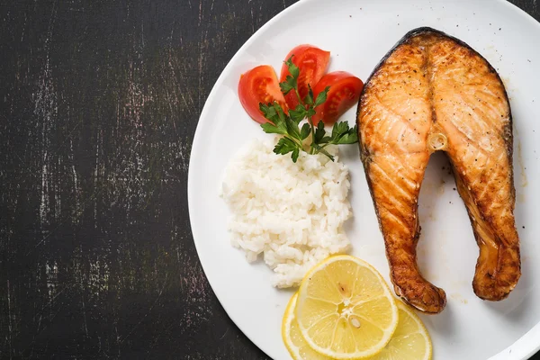 Top view of baked trout with vegetables and rice. Space for text — Stock Photo, Image