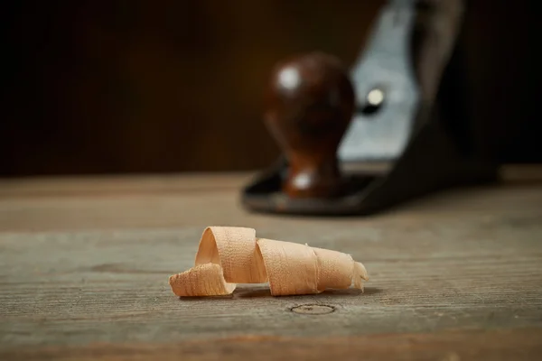 Hand plane on a wooden workbench. — Stock Photo, Image