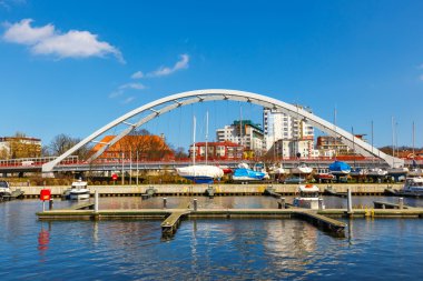 Kolobrzeg, Poland - April 08, 2016: View on harbor in Kolobrzeg with many moored boats and ships. Kolobrzeg is a popular tourist destination clipart