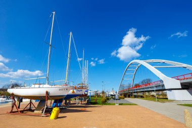 Kolobrzeg, Poland - April 08, 2016: View on harbor in Kolobrzeg with many moored boats and ships. Kolobrzeg is a popular tourist destination clipart