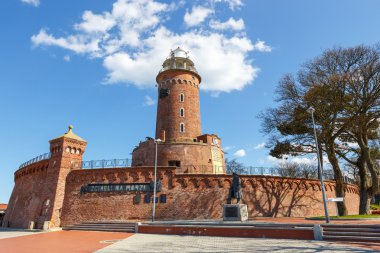 Harbor and the lighthouse in Kolobrzeg, Poland clipart