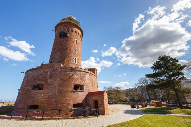 Harbor and the lighthouse in Kolobrzeg, Poland clipart