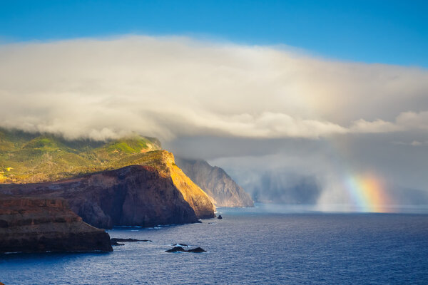 Sunrise and beautiful rainbow over Ponta de Sao Lourenco, Madeira, Portuga